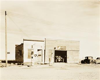 RUSSELL LEE (1903-1986) Post office * Garage at Rawson, McKenzie County, North Dakota * Lumberjacks using peaveys to remove legs from b